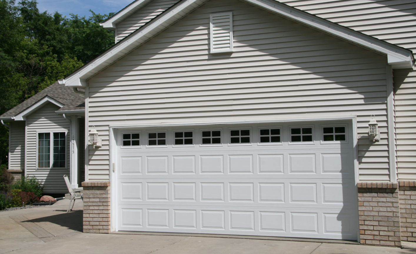 Technician repairing a garage door opener mechanism with professional tools from Garage Door Repair Services Laurel Florida LLC, ensuring safety and reliability."
