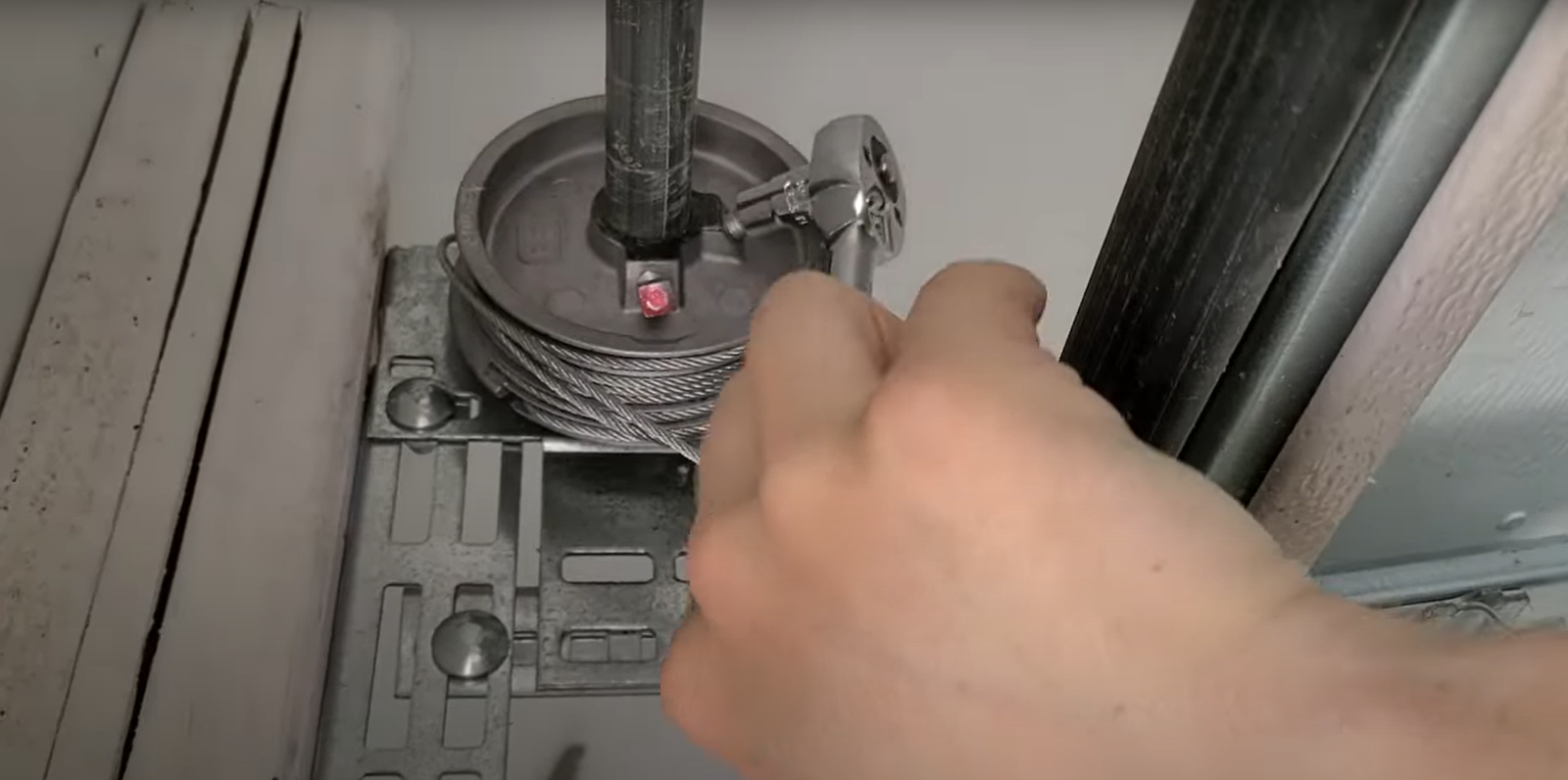 Garage door technician conducting a professional cable inspection for reliable garage door cable repair