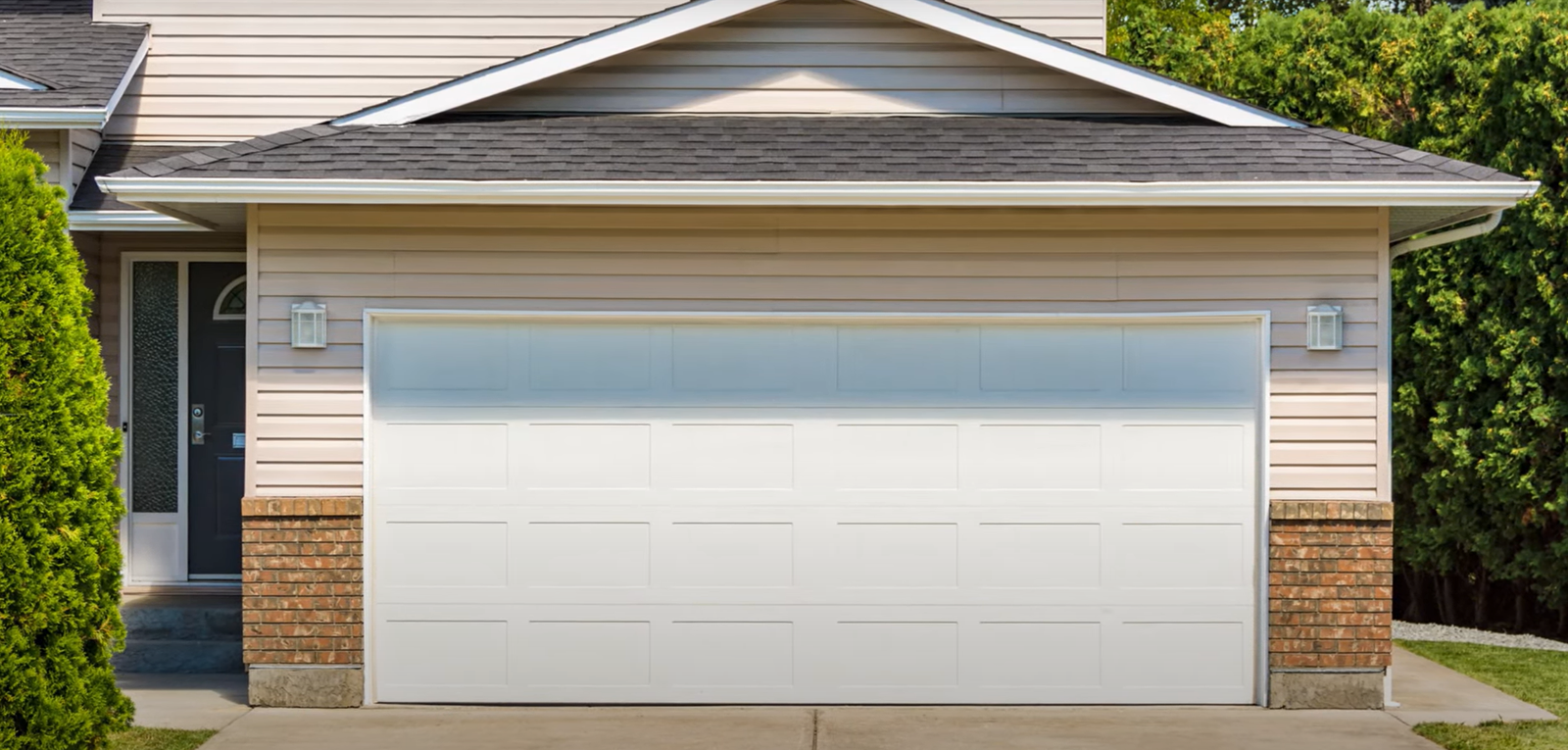 Technician repairing a garage door track for same day garage door repair in Laurel, Florida."