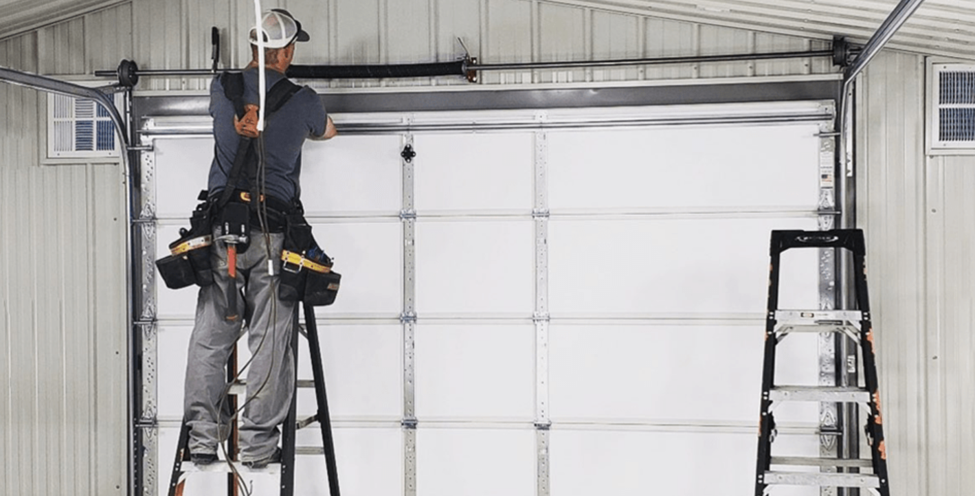 Professional emergency garage door repair technician at work