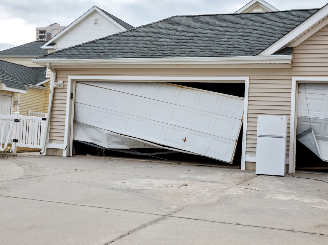 Standard unreinforced garage door buckling under severe storm pressure
