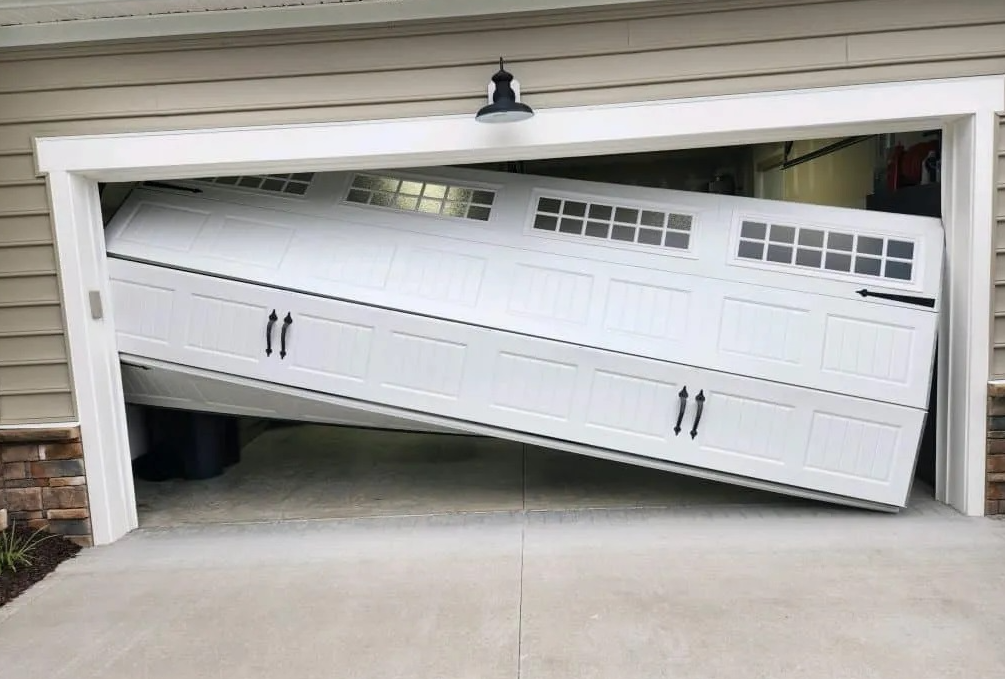 Garage door stuck off tracks and crooked
