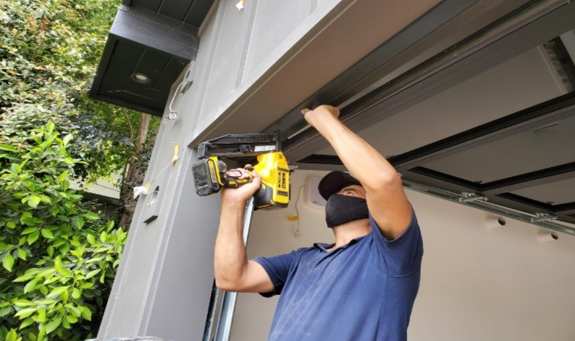 Fully stocked commercial repair truck providing 24/7 emergency garage door service